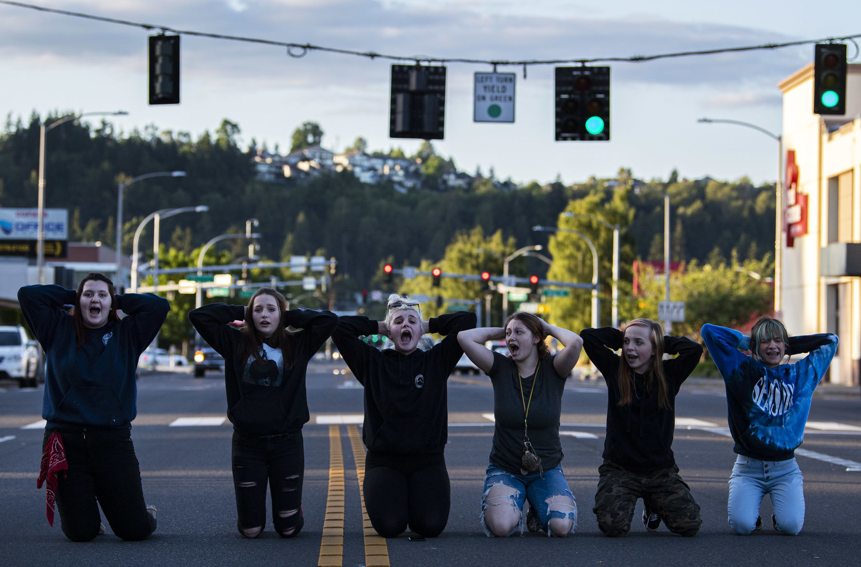 Kneeling in street